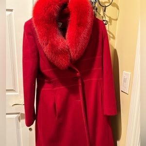 Beautiful woman’s wool coat with fur collar. Compliments any outfit